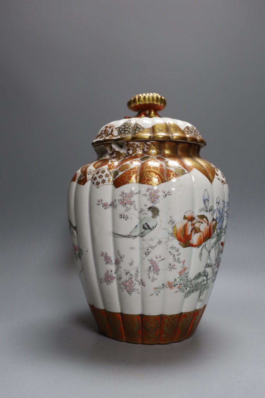 A Japanese kutani bottle vase, similar vase and cover (a.f), an Imari bowl and blue and white bowl. Largest 27cm